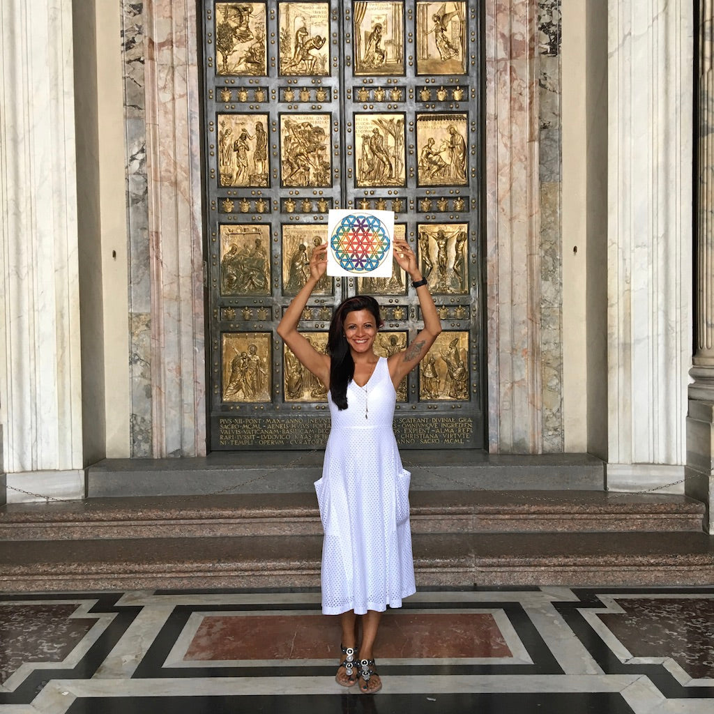 Holding the paining in front of the Vatican