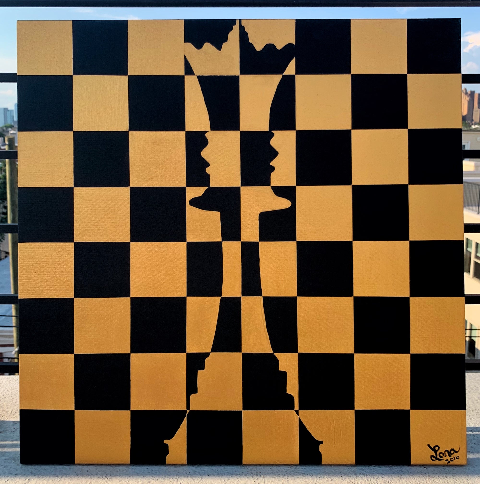 Queen chess piece painted in gold and black
